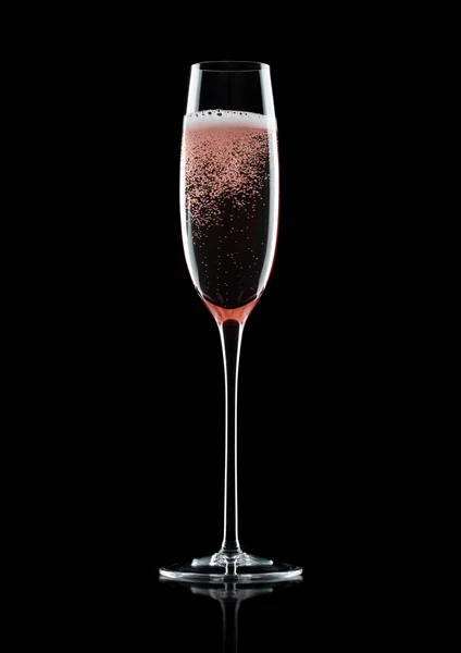 Rose pink champagne glass with bubbles on black — Stock Photo, Image