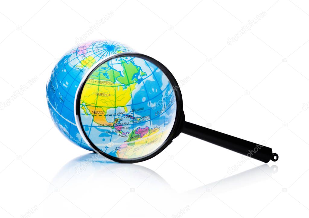 Globe under magnifying glass Amercia and Mexico
