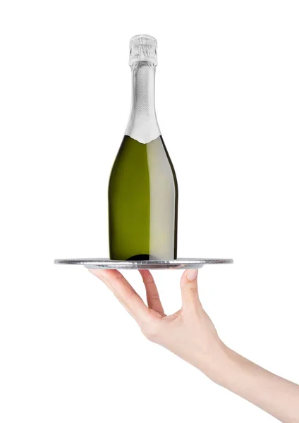 Hand holds tray with yellow champagne bottle — Stock Photo, Image