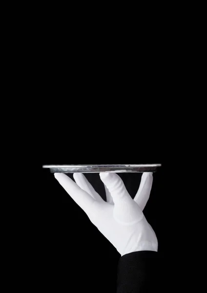 Servant white glove holds stainless steel tray — Stock Photo, Image