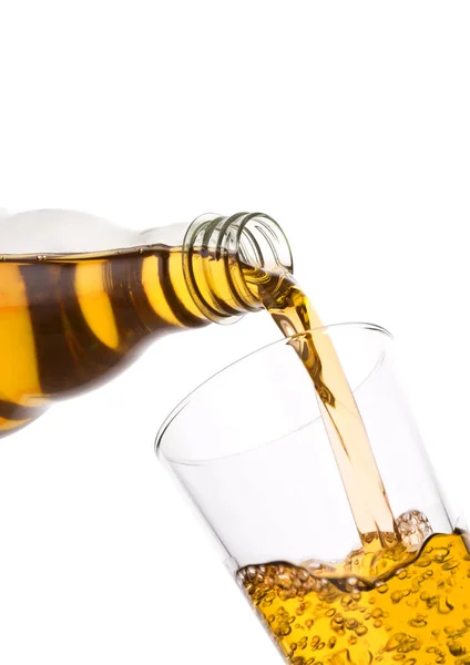 Pouring fresh apple juice from bottle to glass — Stock Photo, Image