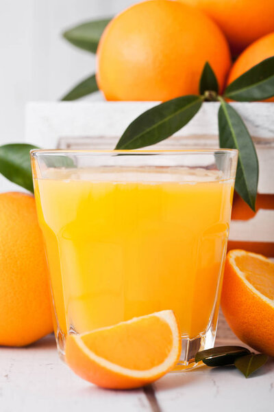 Glass of organic fresh orange juice with fruits