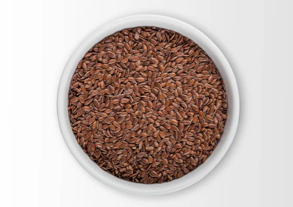 White bowl of raw natural organic linseed flax-seed on white background. — Stock Photo, Image