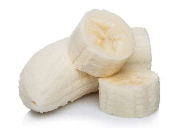 Fresh ripe organic banana sliced pieces on white background with reflection. — Stock Photo, Image