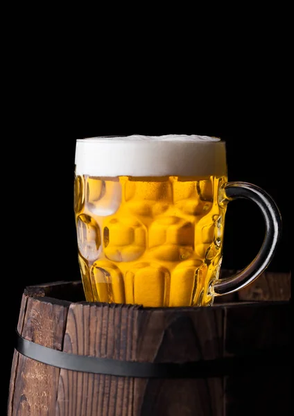 Cold glass of craft beer on old wooden barrel — Stock Photo, Image