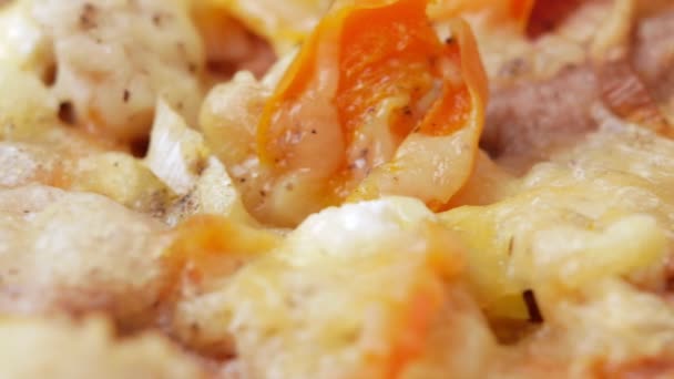 Macro photography of pizza with different types of cheese and tomatoes. Moving camera — Stock Video