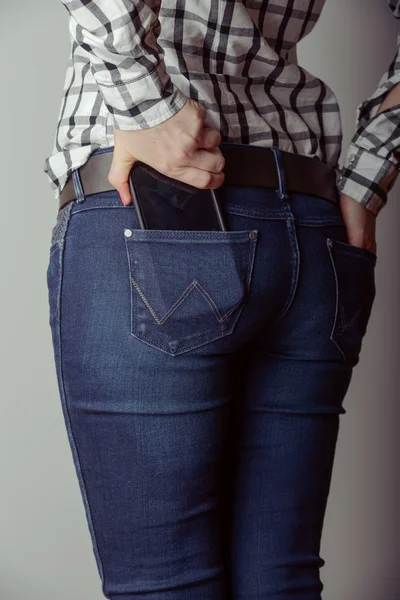 Smartphone in the pocket of jeans — Stock Photo, Image