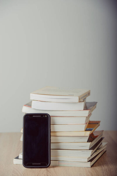 Old vintage books, smartphone