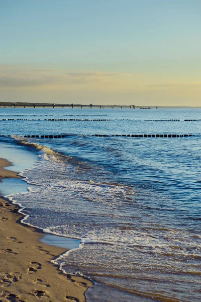 Breakwaters in the Baltic sea over the sunset — Stock Photo, Image