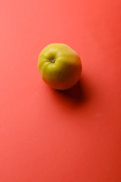 Apple isolated on red background — Stock Photo, Image