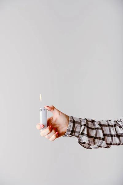 Hand with lighter igniting sparks — Stock Photo, Image