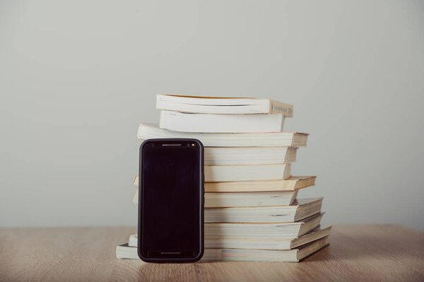 Old vintage books, smartphone