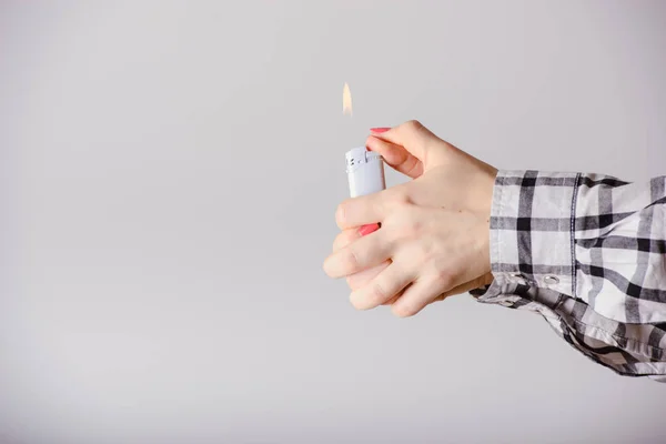 Hand with lighter igniting sparks — Stock Photo, Image