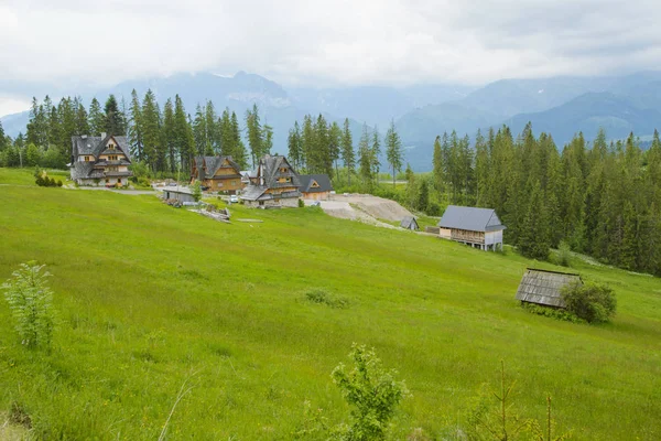 Summer landscape with huts — Stock Photo, Image