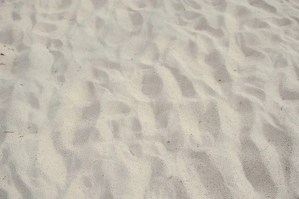Пляжный песок в качестве фона — стоковое фото