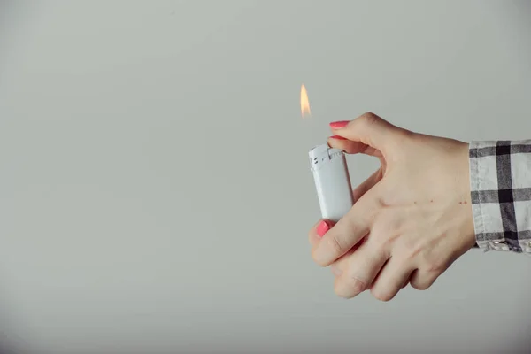 Hand with lighter igniting sparks — Stock Photo, Image