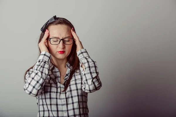 Woman holding hands on her head, headache — Stock Photo, Image