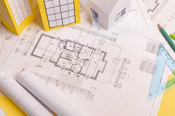 Casa de papel de la familia blanca, plan de proyectos de la casa y planos en Imagen de stock