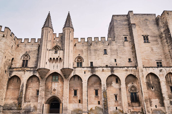 walls of the medieval Castle of the Popes in the city of Avignon in France