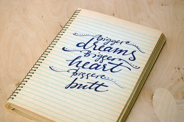 calligraphic background with funny quote on spiral notebook