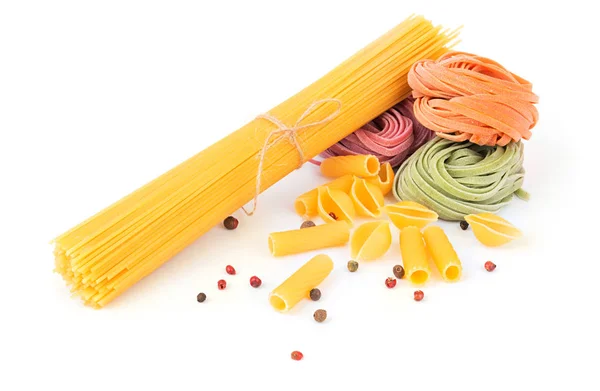 Uncooked pasta on white background — Stock Photo, Image