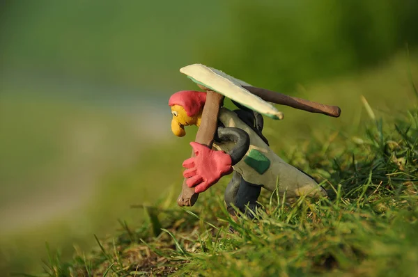 Funny plasticine hang glider pilot figure ready to take off from — Stock Photo, Image