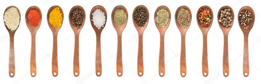 Set of spoons with different spices 