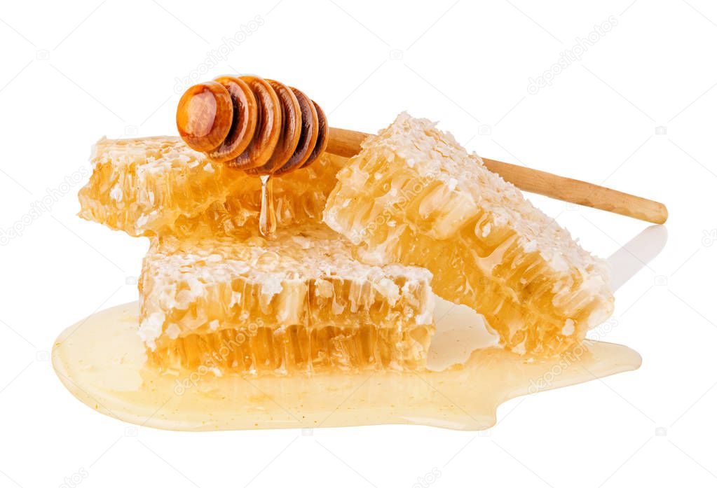 Honeycombs and dipper with pouring honey