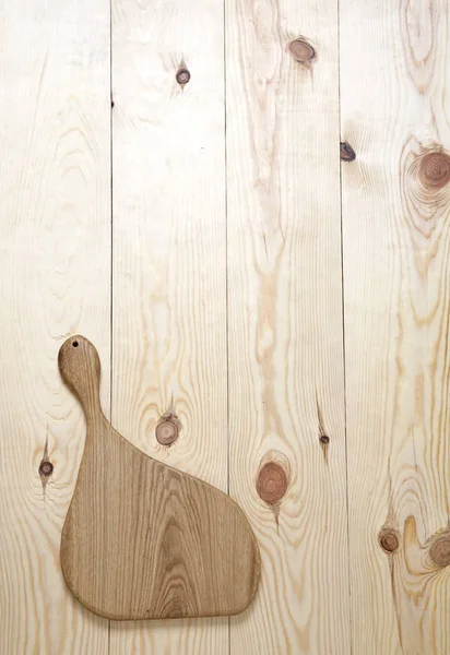 Tagliere su una superficie di legno — Foto Stock