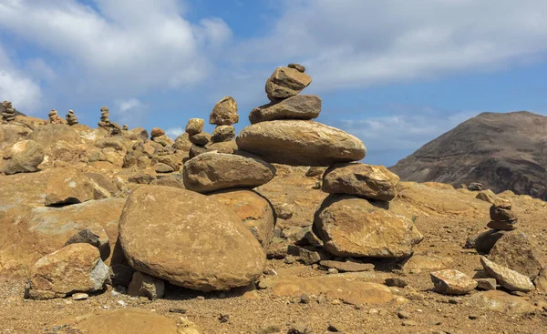 Stacked up small stones in the mountains — Stock Photo, Image