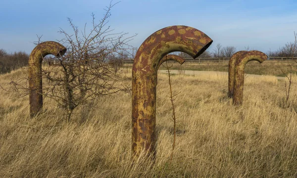 Rusty ventilation pipes over an underground bunker in Rgen — Stock Photo, Image