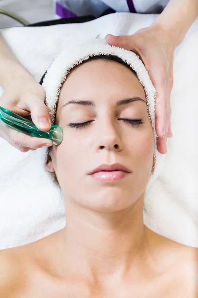 Beautiful young woman receiving cupping treatment in spa. — Stock Photo, Image