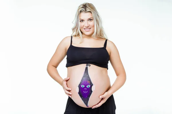 Szép terhes nő hasa festett baba. — Stock Fotó