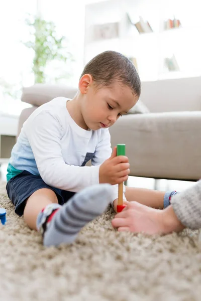 Beautiful young boy playing at home. — Stock Photo, Image