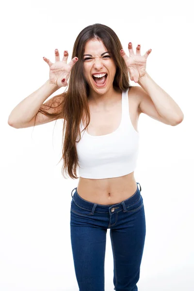 Beautiful young woman shouting and growling like an animal over white background. — Stock Photo, Image