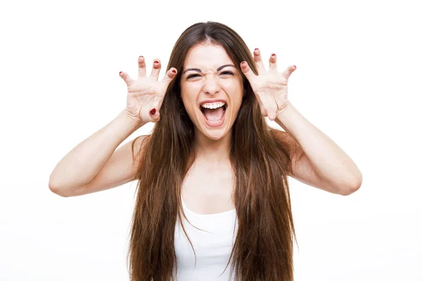 Beautiful young woman shouting and growling like an animal over white background. — Stock Photo, Image