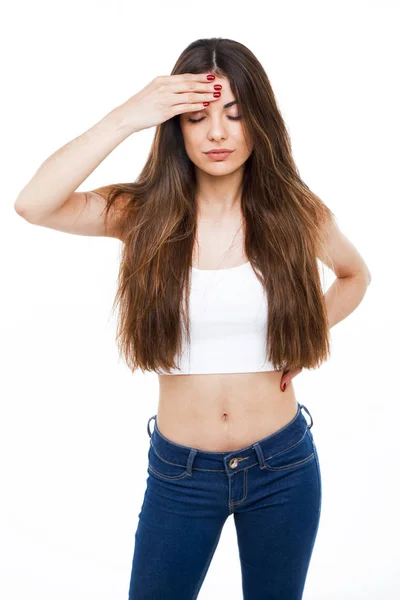 Beautiful young woman having headache over white background. — Stock Photo, Image