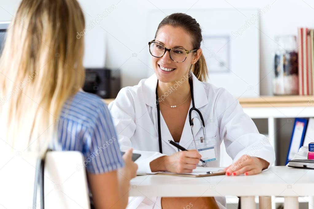 Female doctor explaining diagnosis to her patient.