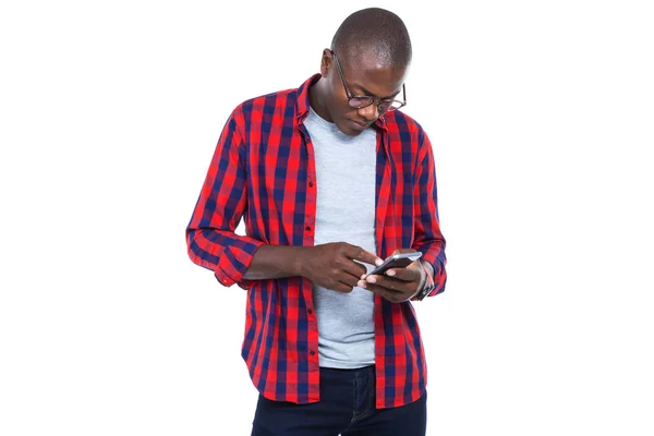 Handsome young man using his mobile phone. Isolated on white. — Stock Photo, Image