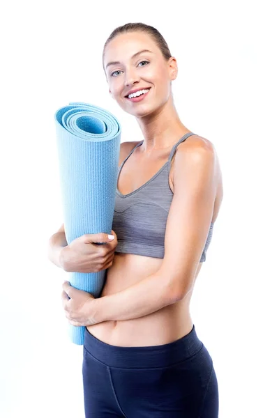 Beautiful young woman posing after doing pilates over white background. — Stock Photo, Image