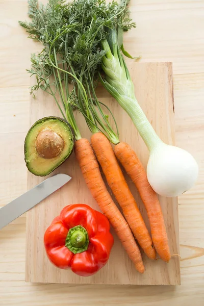 Fresh vegetables under wood background. — Stock Photo, Image