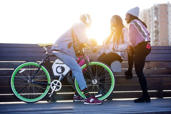 Group of three friends talking in the street. — Stock Photo, Image