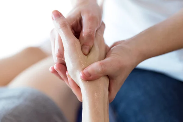 Physiotherapist pressing specific spots on female palm. — Stock Photo, Image