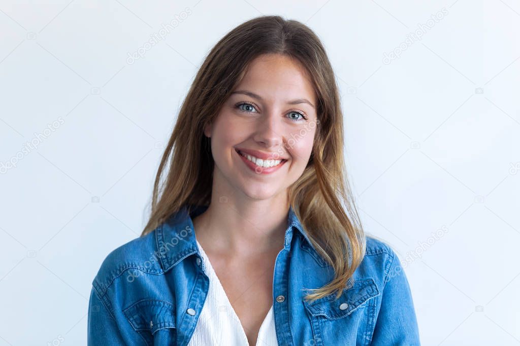 Happy young woman with perfect smile looking at camera. Isolated on white background.