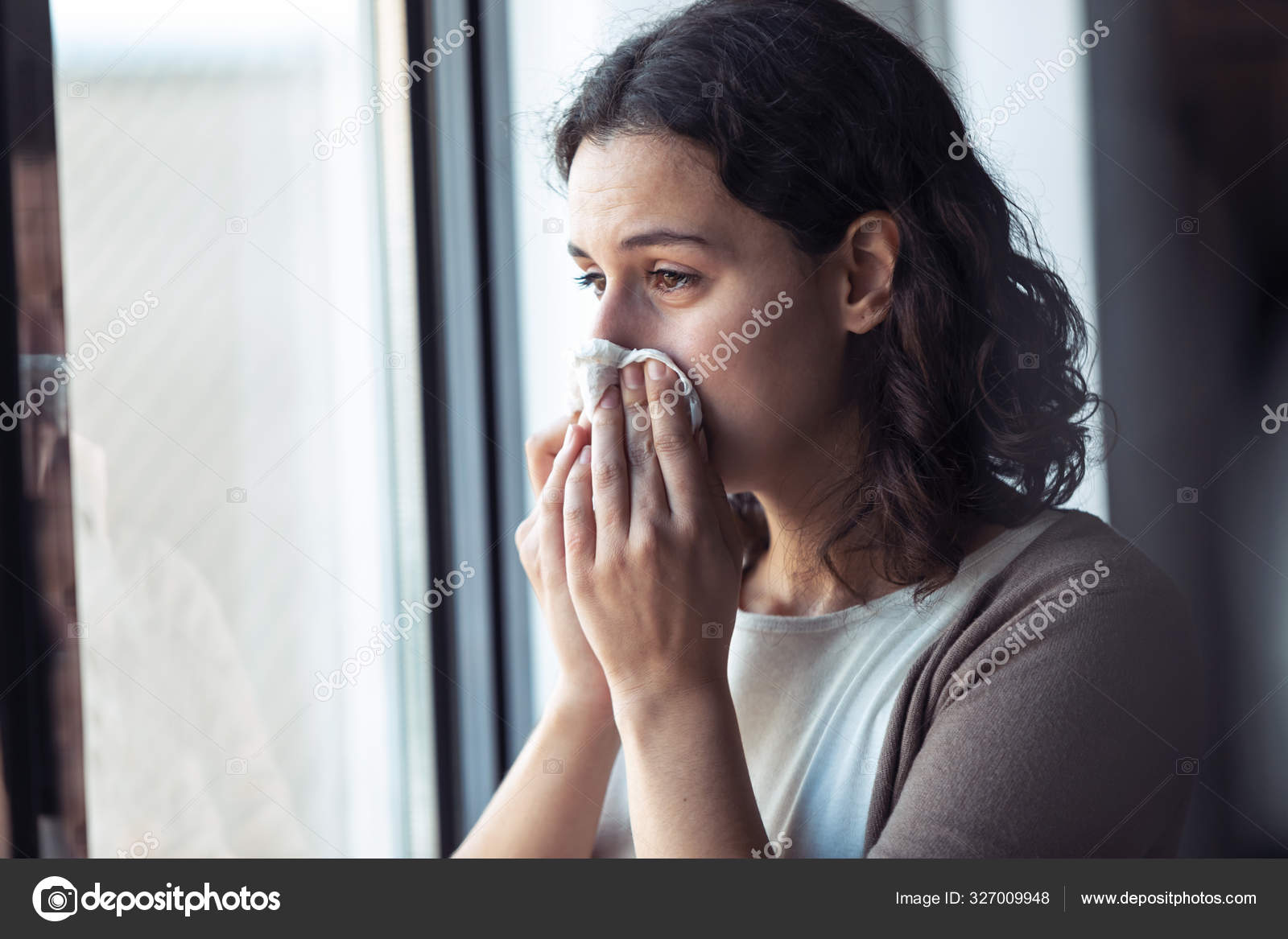 Woman crying at Window