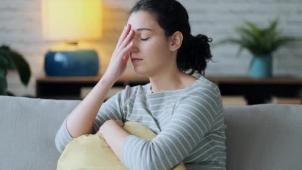 Video Worried Young Woman Thinking While Sitting Sofa Living Room — Stockvideo