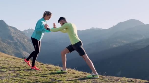 Video Healthy Young Couple Doing Stretching Exercises Together Mountain Trail — Stock Video
