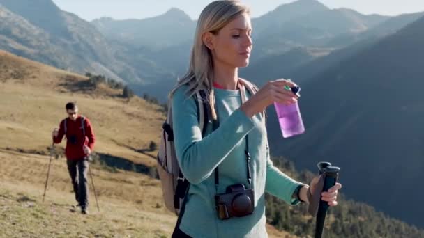 Video Pretty Young Woman Traveler Backpack Drinking Water While Standing — Stockvideo