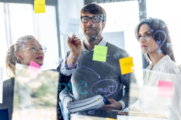 Shot Successful Business Team Writing Notes Office Glass Board While — Stock Photo, Image