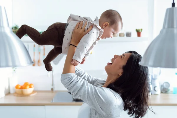 Shot Happy Young Mother Lifting Her Cute Daughter High Air — Stock Photo, Image